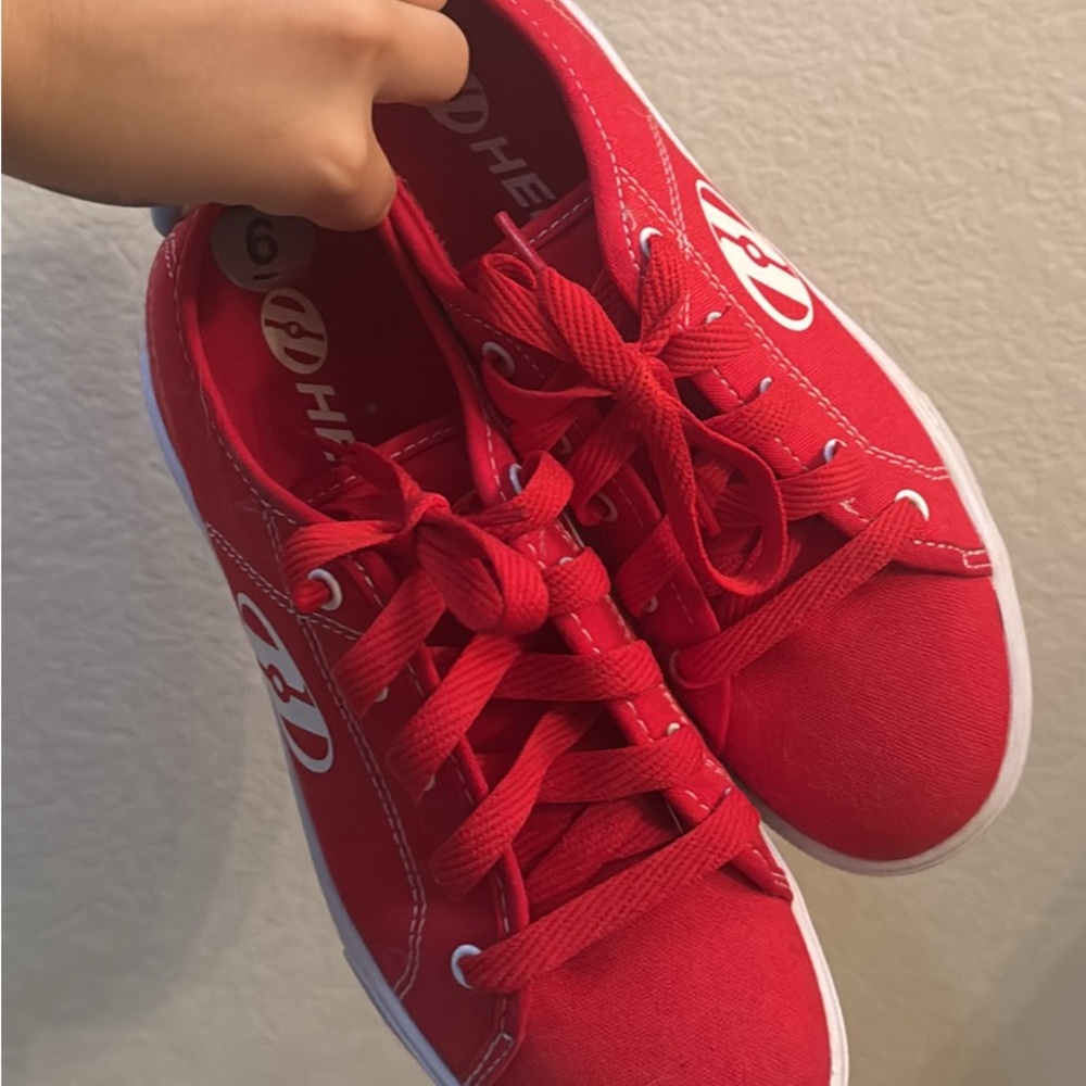 These are original red Heelys. They are brand new with the wheels and bearings.